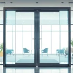 Opening commercial automatic doors in a modern office, showcasing their sleek design and functionality.